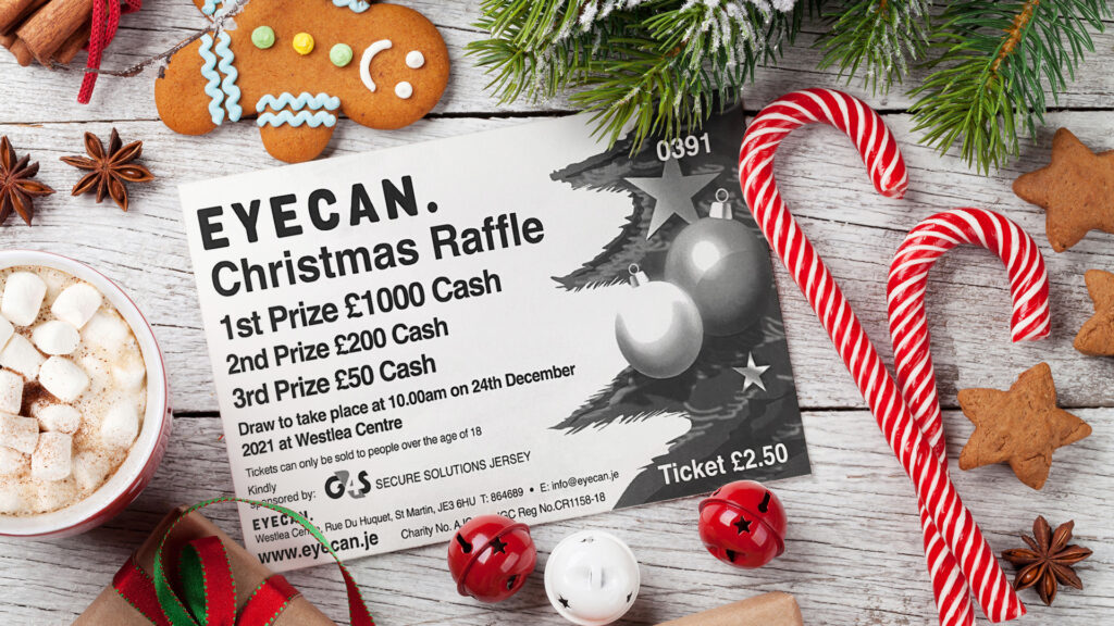 Image shows EYECAN raffle ticket showing prize amounts and details of the draw date. The ticket is surrounded by candy canes, baubles, and festive gingerbread