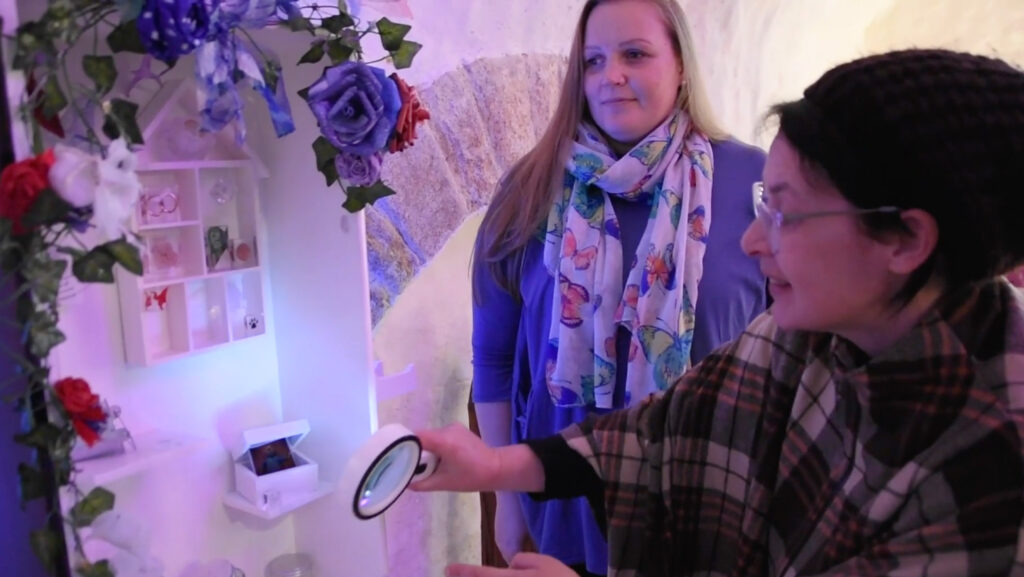 EYECAN member Emilie explaining her floral white art box at the Skipton Big Ideas Exhibition