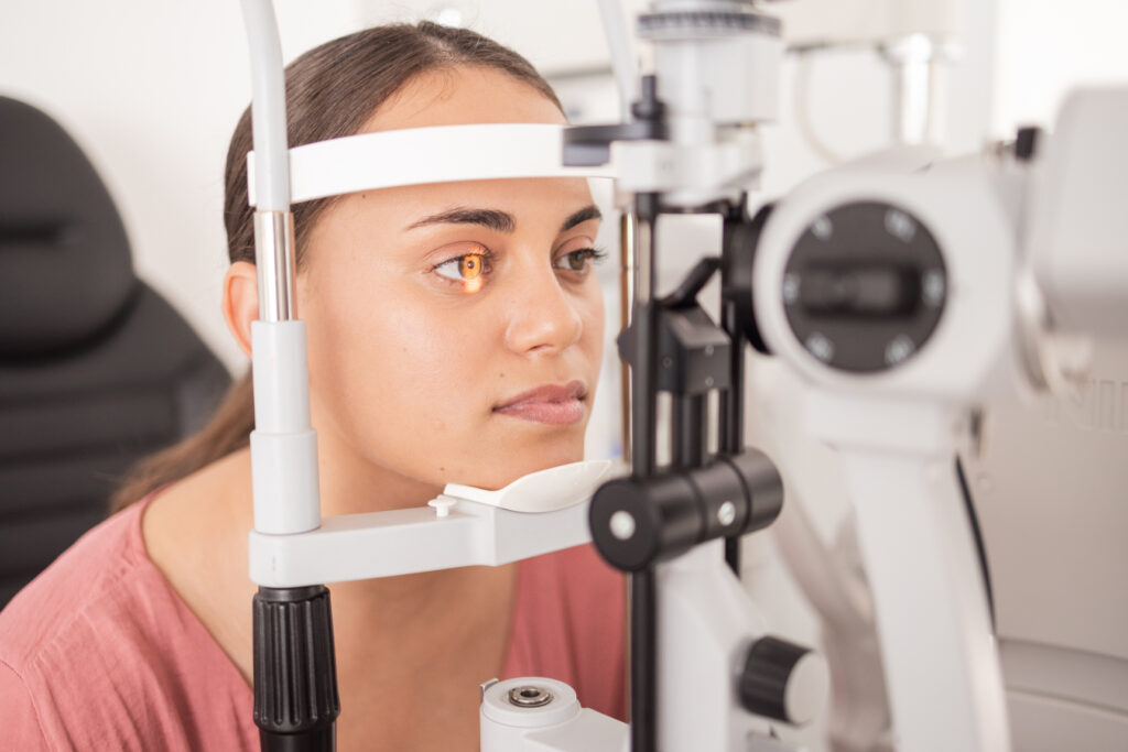 Close up image of a lady's face and eye, as she get's an eye check.