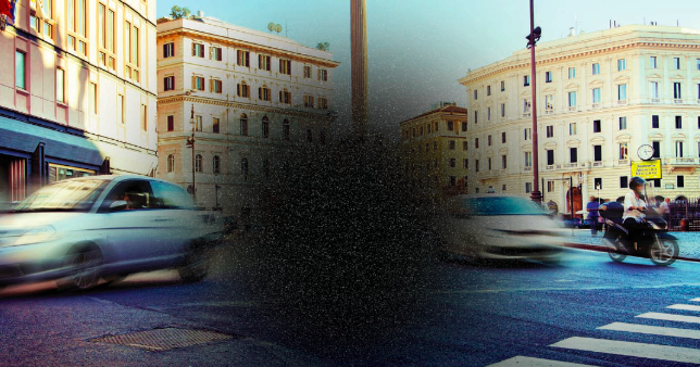 Image shows a view of a busy street crossing with a blurred centre to demonstrate what a person with macular-degeneration might experience.
